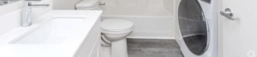 Updated full bathroom with shower/tub combo and washer and dryer in the home