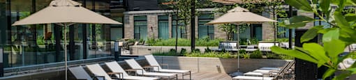 Outdoor Courtyard with Lounge Chairs and Water feature at Arrowwood Apartments, North Bethesda