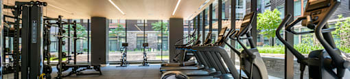 Cardio machines in fitness center at Arrowwood Apartments