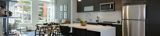 Kitchen Island layout spacious dining room at Arrowwood Apartments, North Bethesda