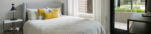Comfortable Bedroom With Large Window at Arrowwood Apartments, North Bethesda, Maryland