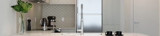Kitchen with Light Finishes featuring Island at Arrowwood Apartments, Maryland