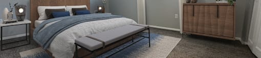 a bedroom with a bed and a dresser