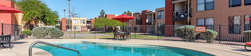 A swimming pool in a residential area with a RentPath logo.