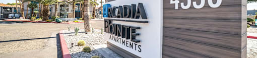 A sign for Arcadia Pointe Apartments with the number 4330 on it.