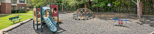 A playground with a slide, swings, and a climbing structure.