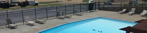 A view of the swimming pool at Cedar Ridge Apartments.