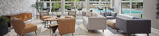 a living room with couches and chairs and a television and a pool