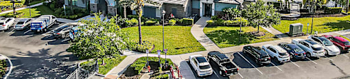 an aerial view of a neighborhood with houses and cars parked