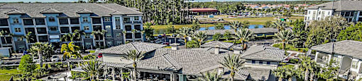 an aerial view of the resort with a swimming pool