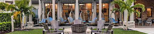 a patio with chairs and a pergola