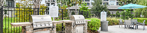 two bbq grills at the enclave at woodbridge apartments in sugar land, tx