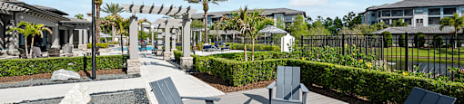 A sunny day at the outdoor seating area with grey furniture.