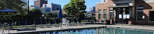 A pool with a ladder in the middle of it.