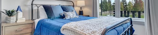 Bedroom With Expansive Windows at Latitude at South Portland Apartment, Maine, 04106