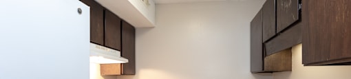 a kitchen at the whispering winds apartments in pearland at Tiffany Square, Rocky Mount