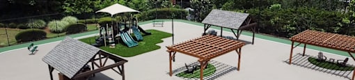 a rendering of courtyard with benches and a playground at Preserve  at Mill Creek, Buford, GA 30519