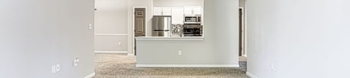 Unfurnished Living room with wooden flooring and ceiling fan and light at Preserve  at Mill Creek, Buford, GA 30519