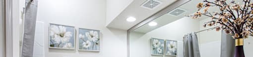 a bathroom with a large mirror