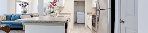 a kitchen and living room in a 555 waverly unit