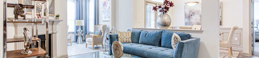 a living room filled with furniture and a ceiling fan