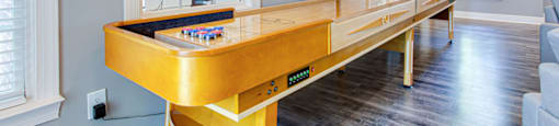 a games room with a foosball table and a ping pong table