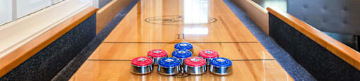 a ping pong table in front of a large window