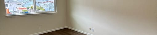 A room with a window and wooden flooring. 419 Baden Avenue 419 Baden Avenue  South San Francisco, CA 94080