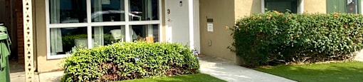 a house with a lawn in front of it