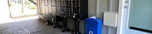 a row of refrigerators sit outside of a building