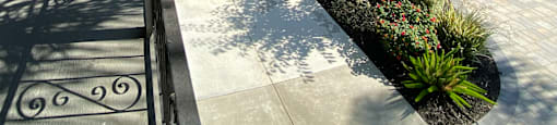 a view of the sidewalk in front of a building