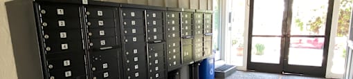 a view of the inside of a building with a row of cabinets on the floor
