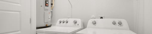 A laundry room with a washer and dryer.