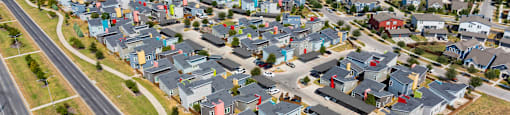 A suburban neighborhood with houses in various colors.