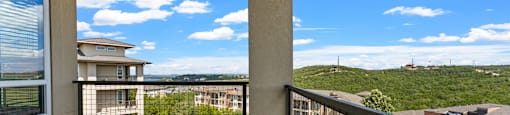 A balcony with a view of a residential area.