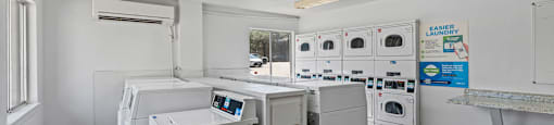 A laundry room with a sign that says "EASIER LONDON".