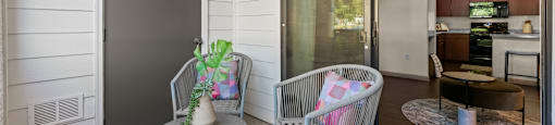 A patio with a chair and table.