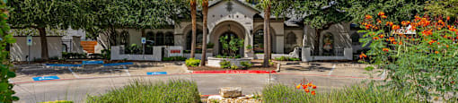 A building with a garden in front of it.