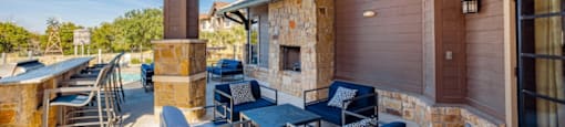 A patio with a table and chairs is shown.