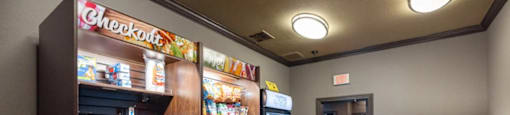 A check out section of a store with a variety of products.