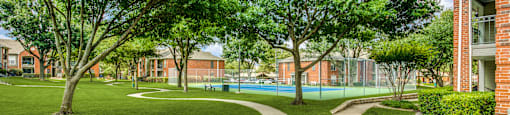 Stroll through our beautifully landscaped walking paths that lead you right to our tennis and pickleball court—perfect for staying active close to home.