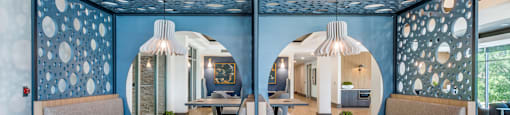 a restaurant with blue walls and tables and chairs
