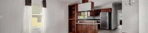 spacious living room with window and easy access to kitchen at Forest Vista, La Porte, TX 77571
