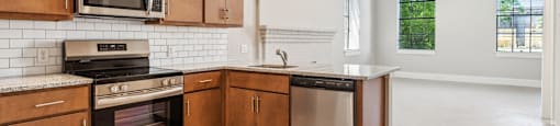 a large kitchen with wooden cabinets and stainless steel appliances