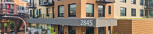 A modern apartment building with the number 2845 on the front.