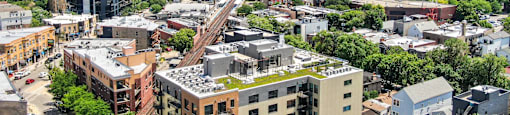 A cityscape with a mix of residential and commercial buildings.