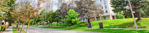 a city street with tall buildings on the side of it