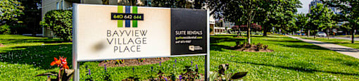 a sign in front of a park