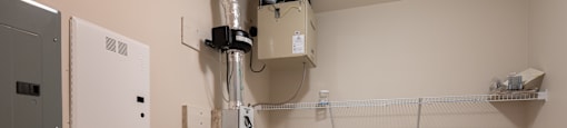 a utility room with a washer and dryer and a dryer in it
