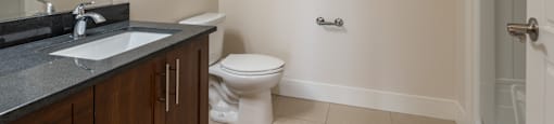 an empty bathroom with a toilet and a sink